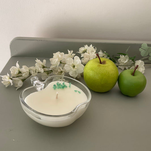 Clear glass candle in apple pie fragrance